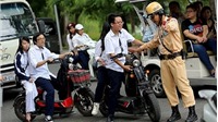 Hà Nội: Đẩy mạnh kiểm tra, xử lý vi phạm không đội mũ bảo hiểm khi đi xe máy, xe đạp điện